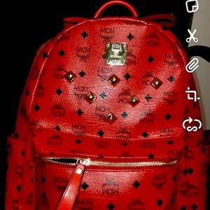 mcm red and black backpack